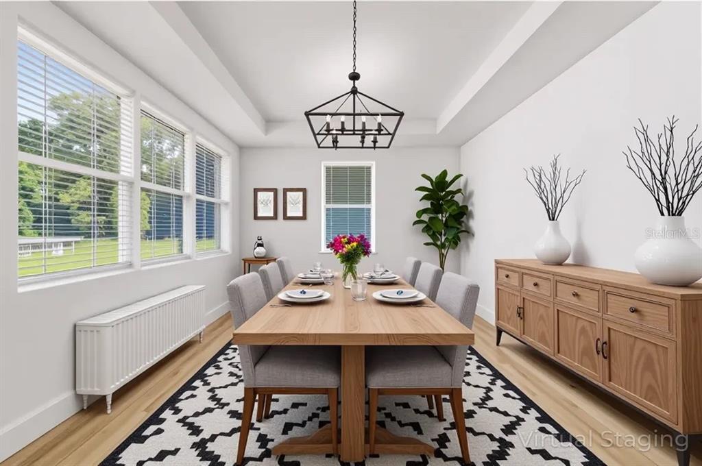 7 Oak Trail Ocala, FL 34472 - Photo 16 of 73 a view of a dining room with furniture window and wooden floor