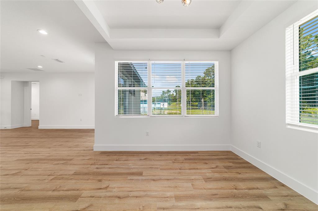 7 Oak Trail Ocala, FL 34472 - Photo 19 of 73 a view of an empty room with wooden floor and a window