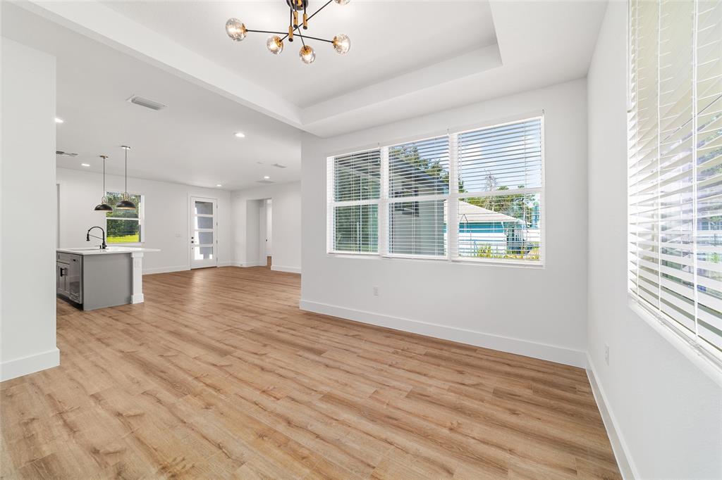 7 Oak Trail Ocala, FL 34472 - Photo 20 of 73 a view of an empty room with a window and wooden floor