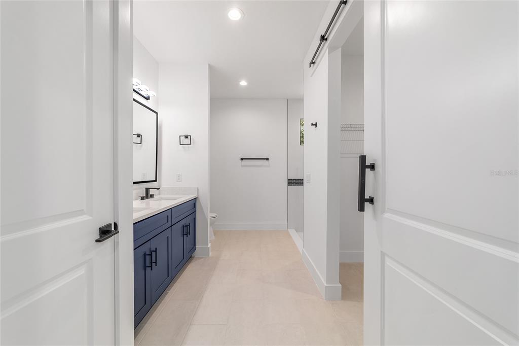 7 Oak Trail Ocala, FL 34472 - Photo 36 of 73 a bathroom with a granite countertop sink a mirror and a bathtub