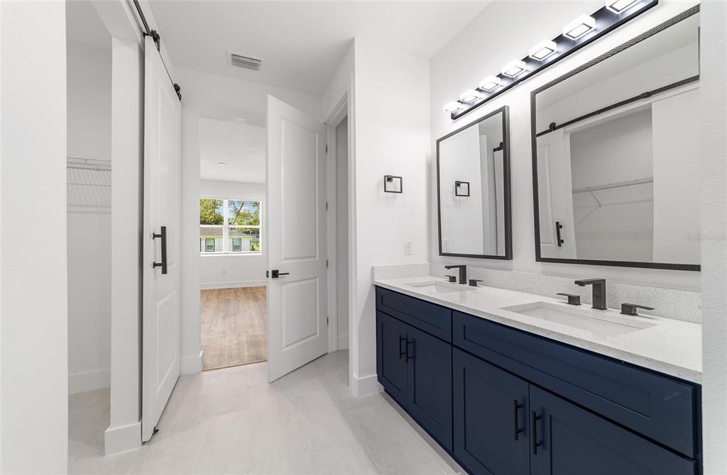 7 Oak Trail Ocala, FL 34472 - Photo 38 of 73 a bathroom with a double vanity sink and mirror