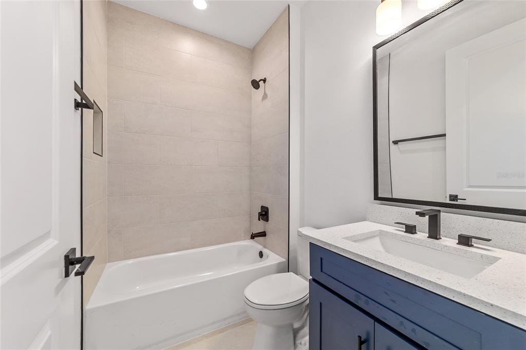 7 Oak Trail Ocala, FL 34472 - Photo 44 of 73 a bathroom with a granite countertop sink a toilet and shower