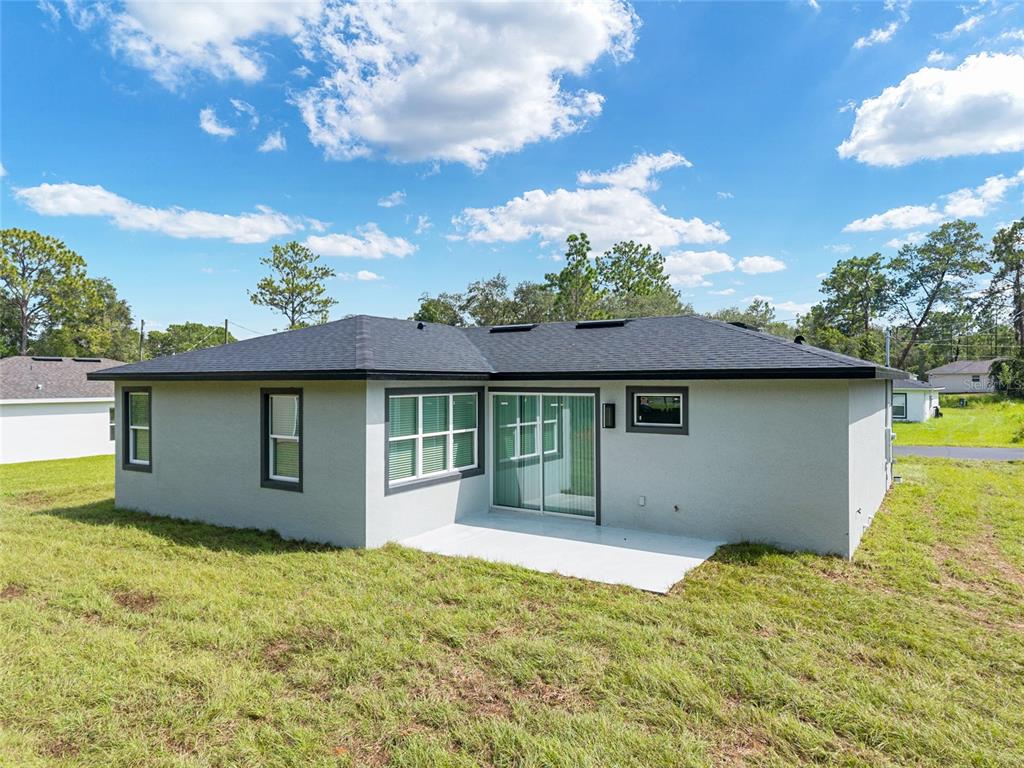 7 Oak Trail Ocala, FL 34472 - Photo 56 of 73 front view of a house with a yard