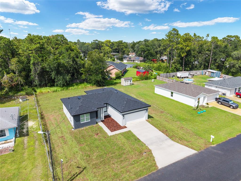 7 Oak Trail Ocala, FL 34472 - Photo 64 of 73 an aerial view of a house with a garden