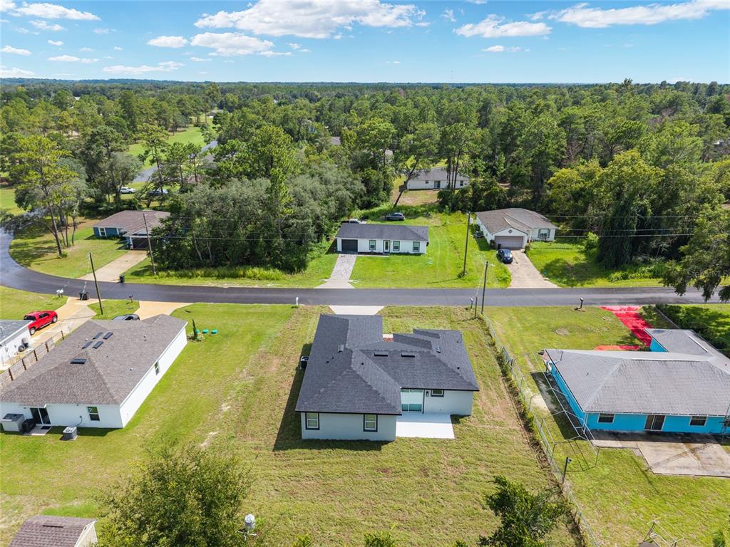 7 Oak Trail Ocala, FL 34472 - Photo 66 of 73 swimming pool view with a garden and plants