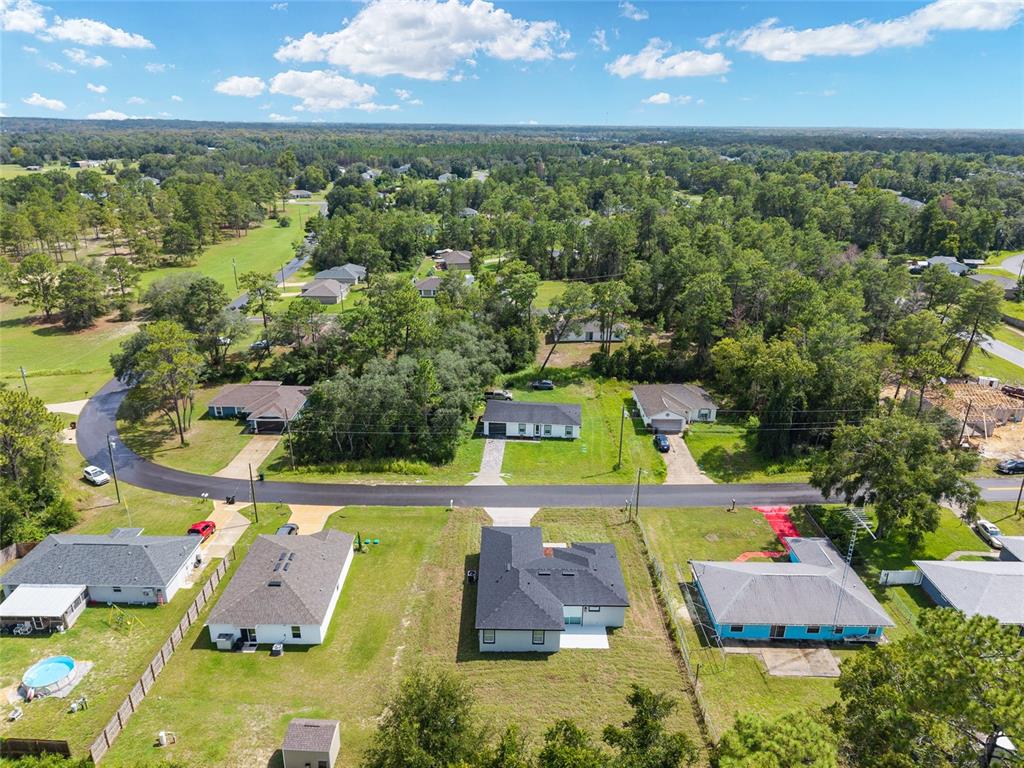 7 Oak Trail Ocala, FL 34472 - Photo 68 of 73 an aerial view of residential houses with outdoor space and swimming pool