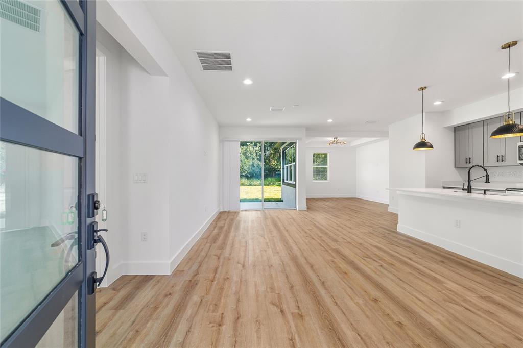7 Oak Trail Ocala, FL 34472 - Photo 7 of 73 a view of empty room with wooden floor and window