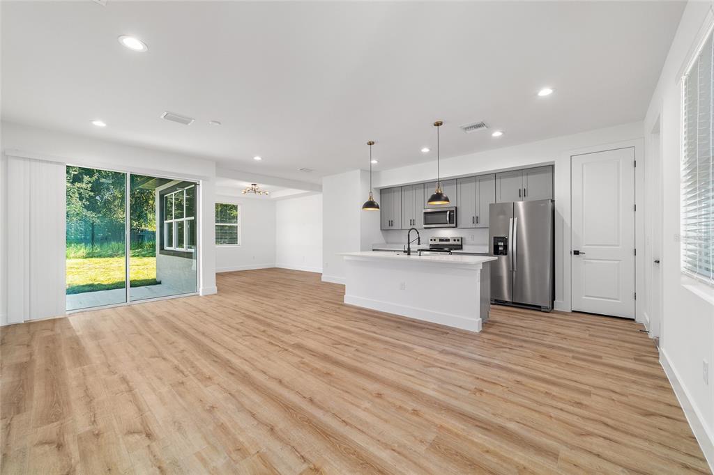 7 Oak Trail Ocala, FL 34472 - Photo 8 of 73 a view of kitchen with wooden floor and windows