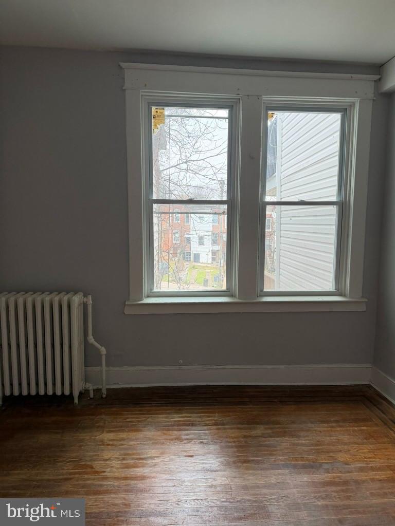 2464 Keyworth Avenue Baltimore, MD 21215 - Photo 13 of 36 a view of a room with wooden floor and windows