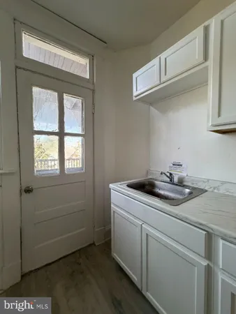 a kitchen with a refrigerator and a stove
