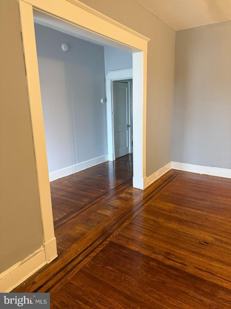 2464 Keyworth Avenue Baltimore, MD 21215 - Photo 7 of 36 a view of an empty room with wooden floor