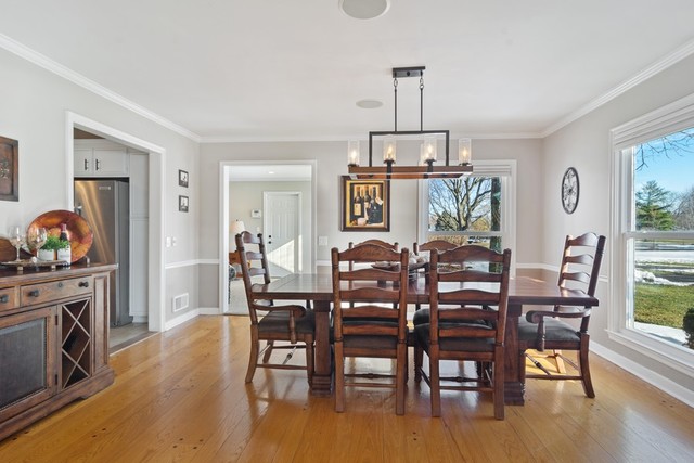 84 North Highland Road Inverness, IL 60067 - Photo 3 of 18 a view of a dining room with furniture window and wooden floor