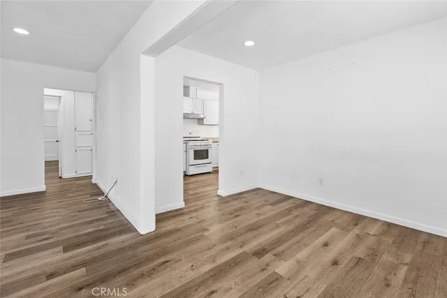 a view of a room with wooden floor and closet