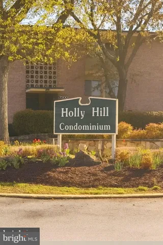 a view of a street with a building in the background