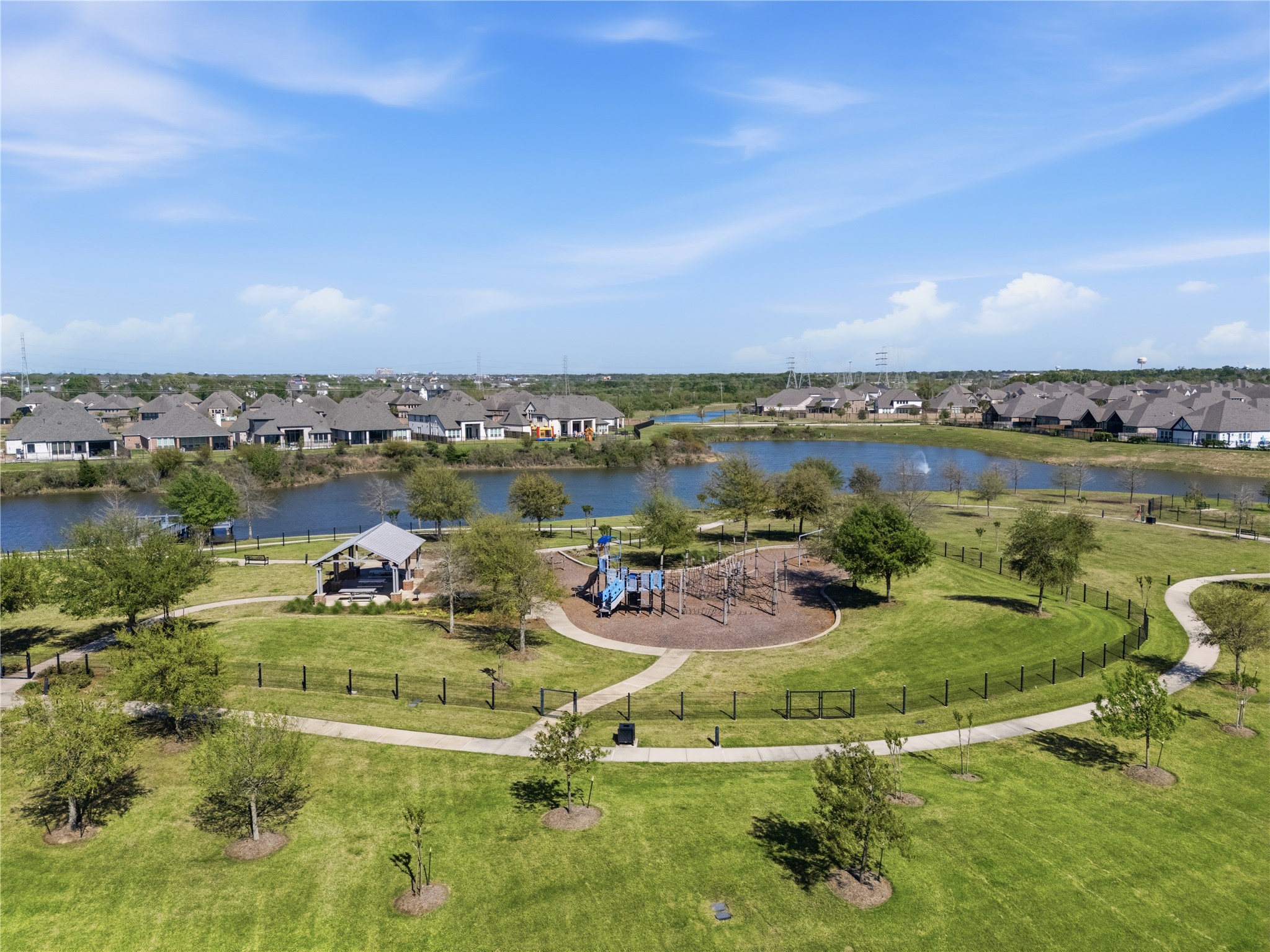 416 Bartlett Street Webster, TX 77598 - Photo 48 of 49 Aerial of community park with lake views, playground, and walking trail