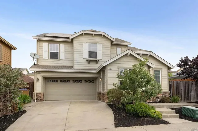a front view of a house with garage