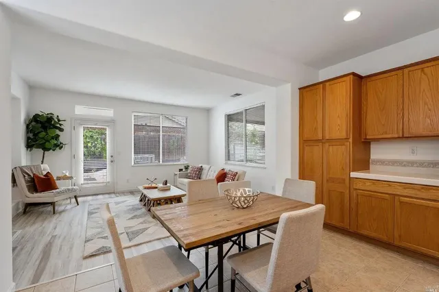 a living room with furniture a window and a table