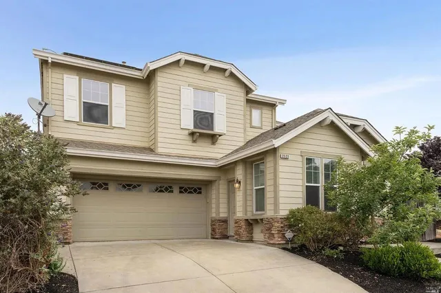 a front view of a house with garage