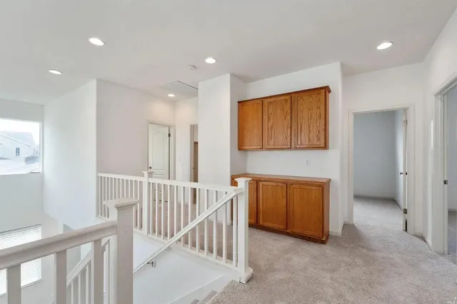 a view of hallway with a window and entryway