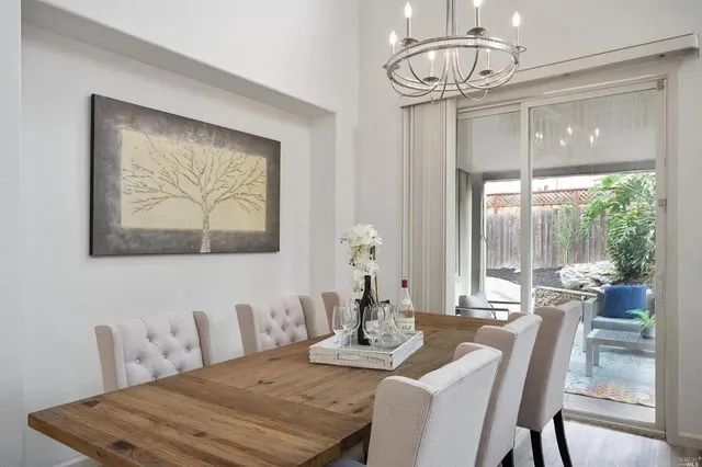 a view of a dining room with furniture window and outside view