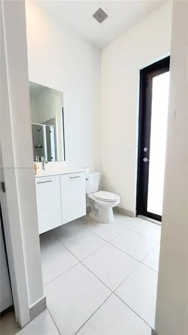 a bathroom with a toilet and a sink