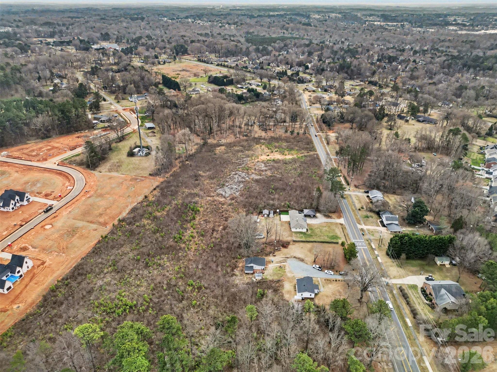 11733 Idlewild Road Matthews, NC 28105 - Photo 11 of 19 an aerial view of residential houses with outdoor space