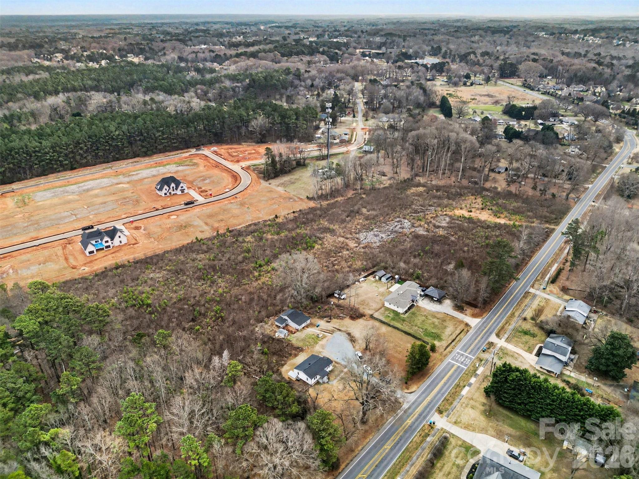 11733 Idlewild Road Matthews, NC 28105 - Photo 15 of 19 an aerial view of residential houses with outdoor space