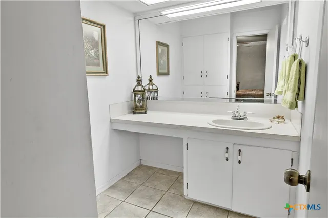 a bathroom with a sink and a mirror