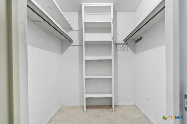 a view of an empty walk in closet