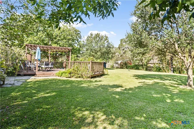 a view of a park with large trees