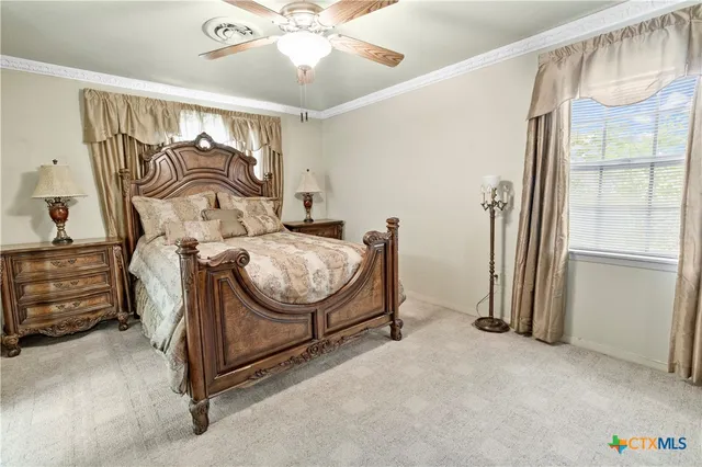 a bedroom with furniture and a window