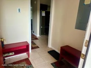 a hallway with a couch and a dresser