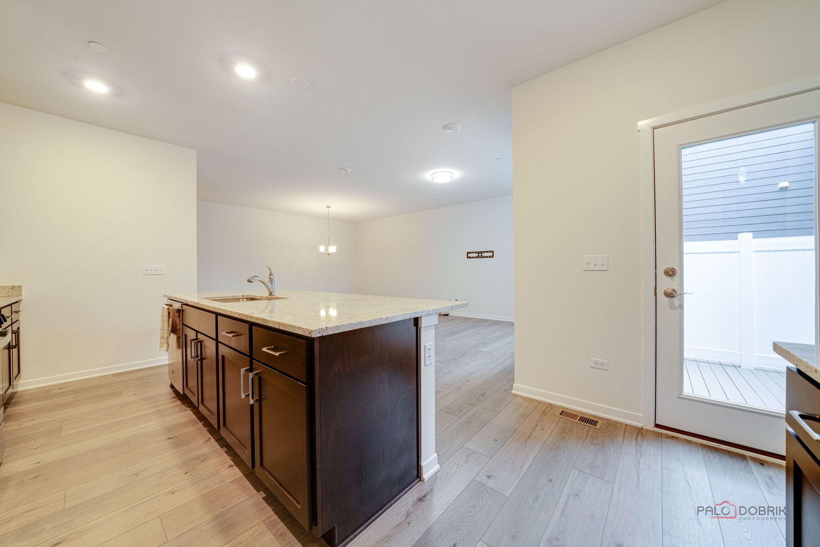 356 Hoffmann Drive Buffalo Grove, IL 60089 - Photo 17 of 35 a kitchen with stainless steel appliances granite countertop a sink and wooden floor
