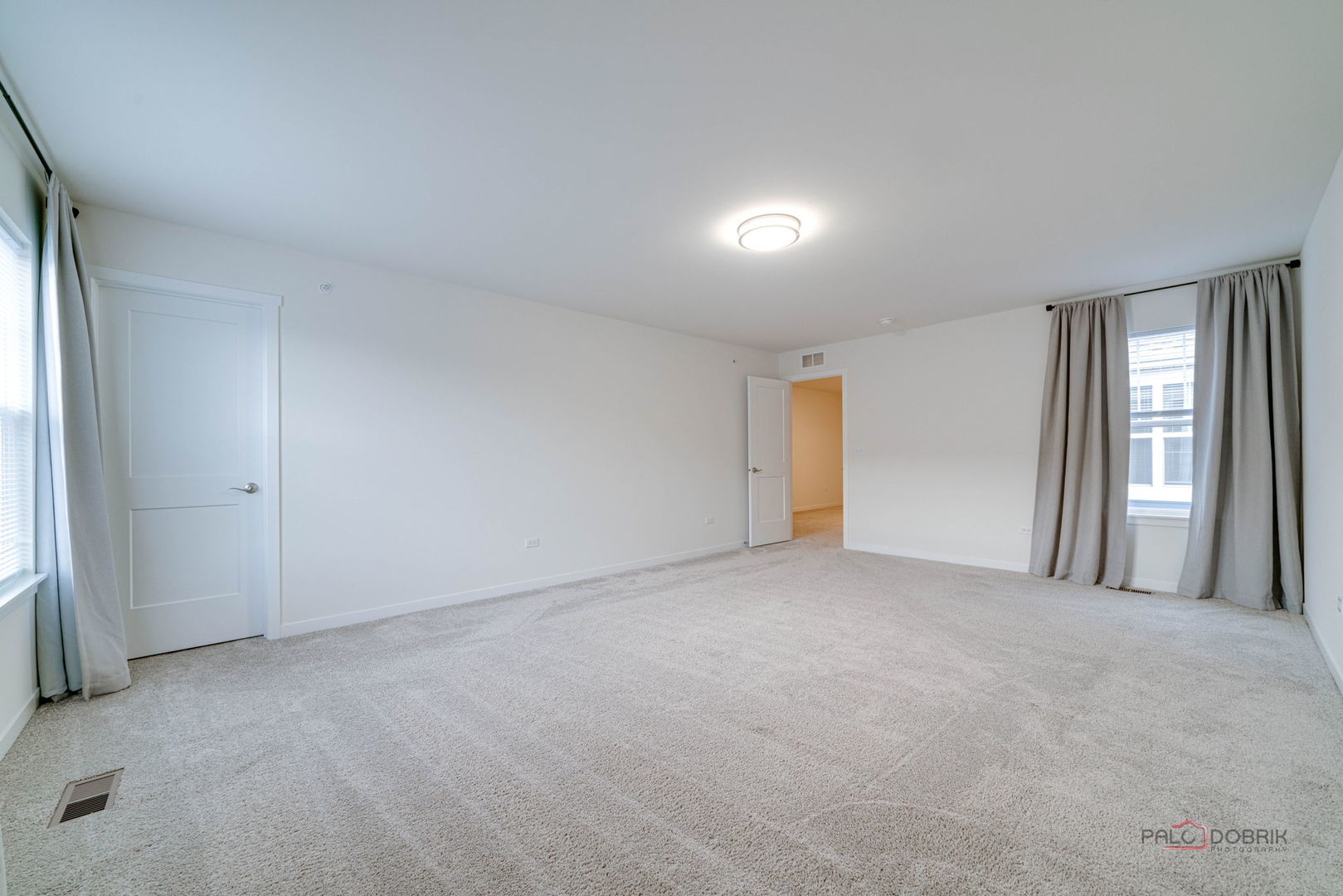 356 Hoffmann Drive Buffalo Grove, IL 60089 - Photo 30 of 35 an empty room with windows and closet