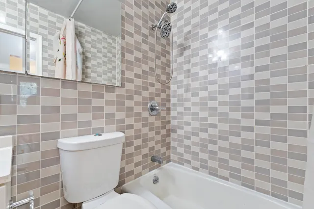 a bathroom with a bathtub and sink