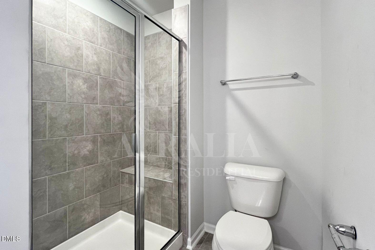181 Ivy Vine Way Raleigh, NC 27610 - Photo 12 of 22 a bathroom with a toilet and a shower