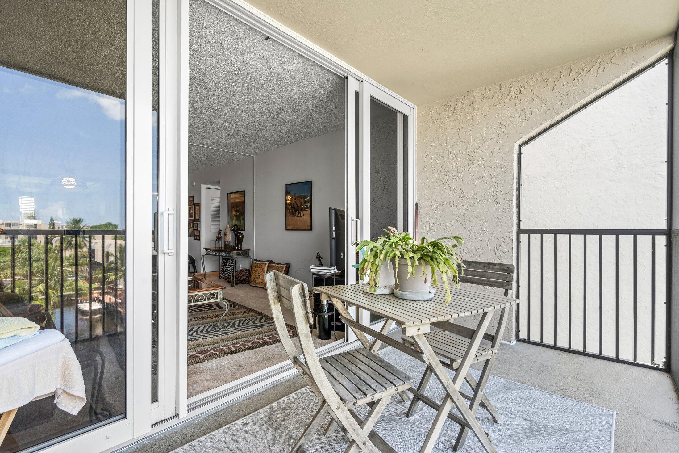 17 Royal Palm Way, Unit 504 Boca Raton, FL 33432 - Photo 26 of 44 a dining room with furniture and wooden floor