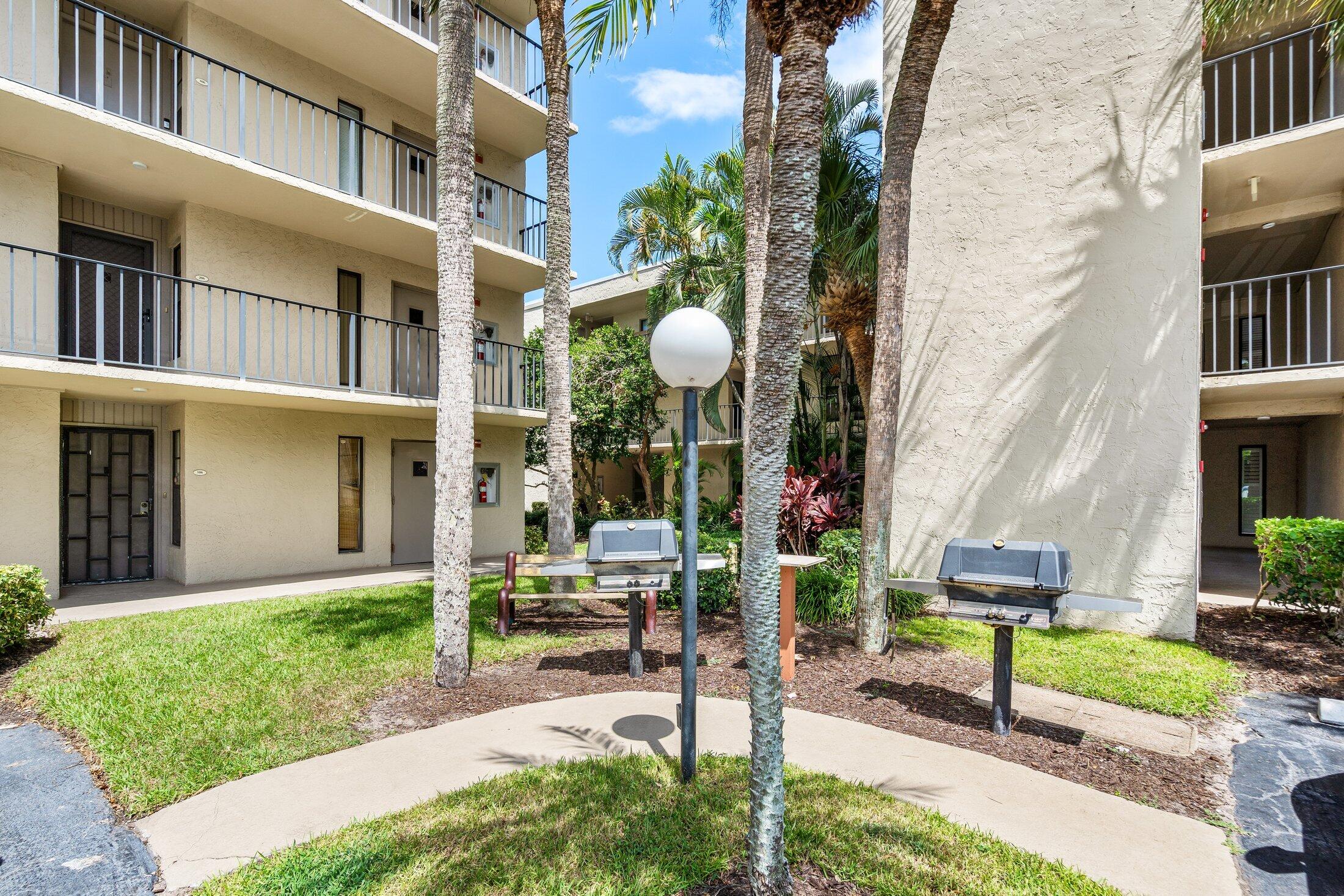 17 Royal Palm Way, Unit 504 Boca Raton, FL 33432 - Photo 27 of 44 a front view of a building with garden