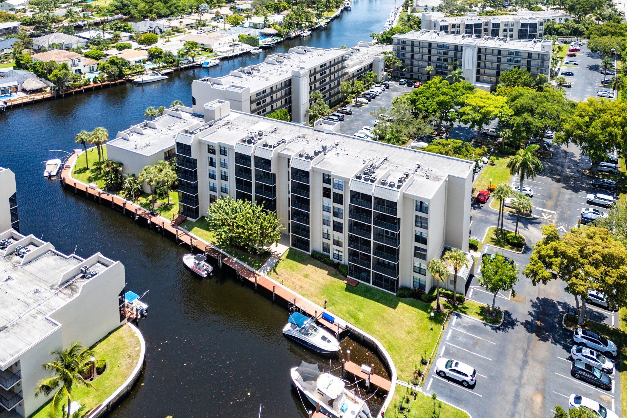 17 Royal Palm Way, Unit 504 Boca Raton, FL 33432 - Photo 32 of 44 an aerial view of a house with a swimming pool and outdoor seating