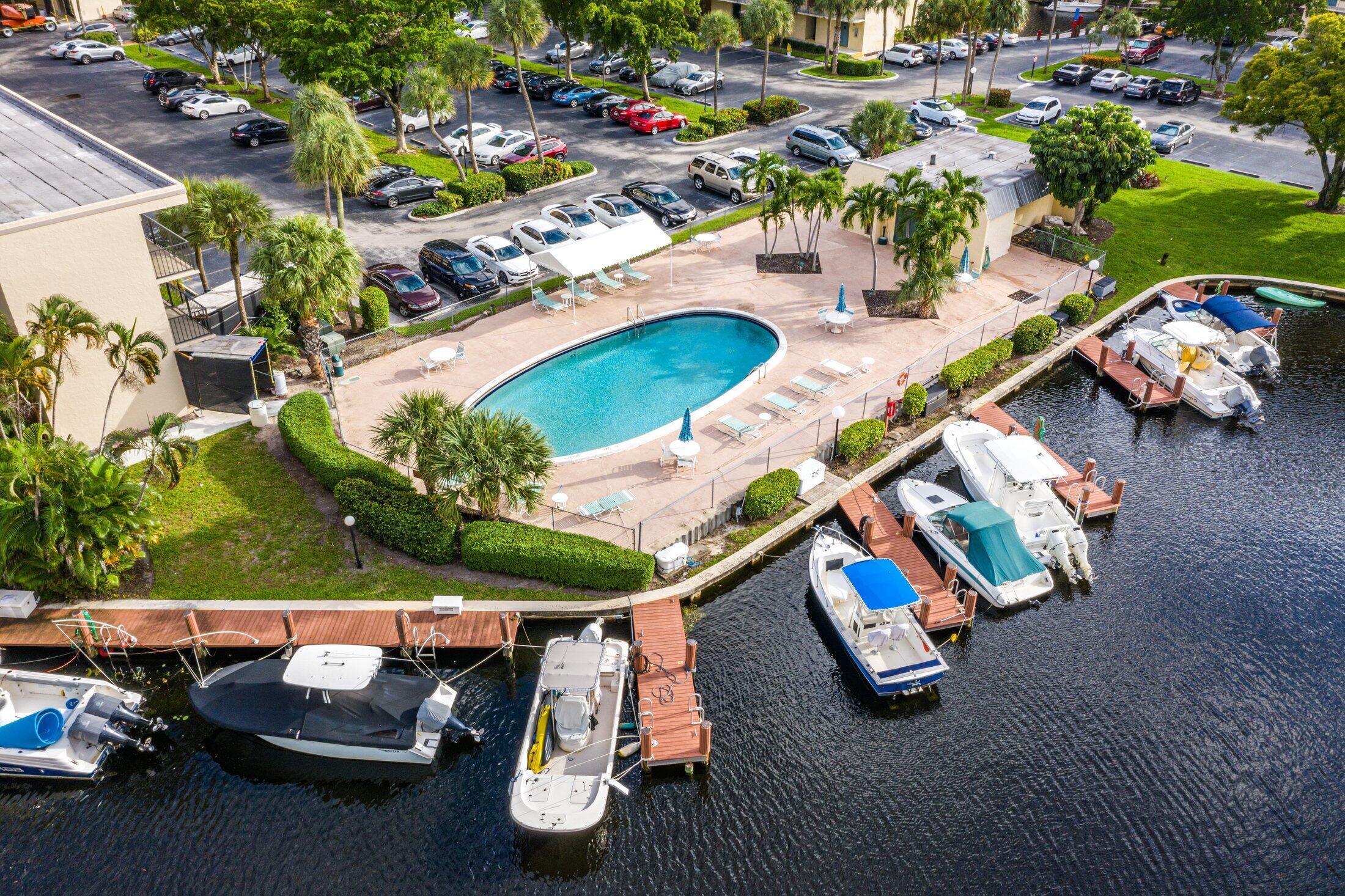17 Royal Palm Way, Unit 504 Boca Raton, FL 33432 - Photo 41 of 44 an aerial view of a house with a swimming pool yard and outdoor seating