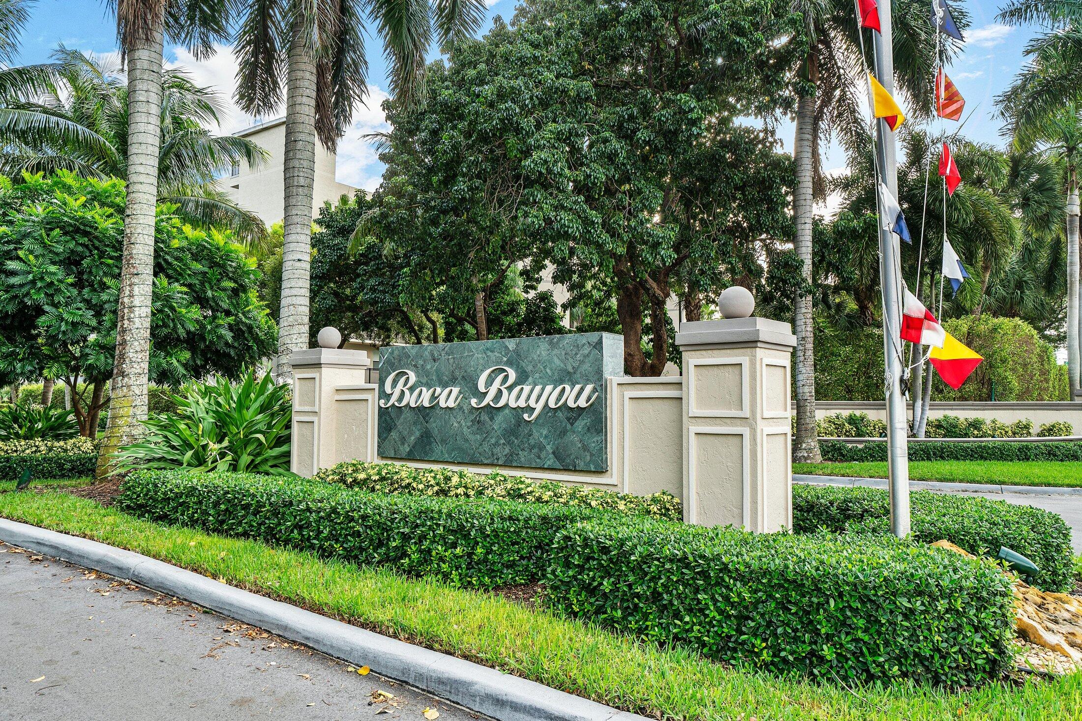 17 Royal Palm Way, Unit 504 Boca Raton, FL 33432 - Photo 44 of 44 a sign that is sitting on a lush green field