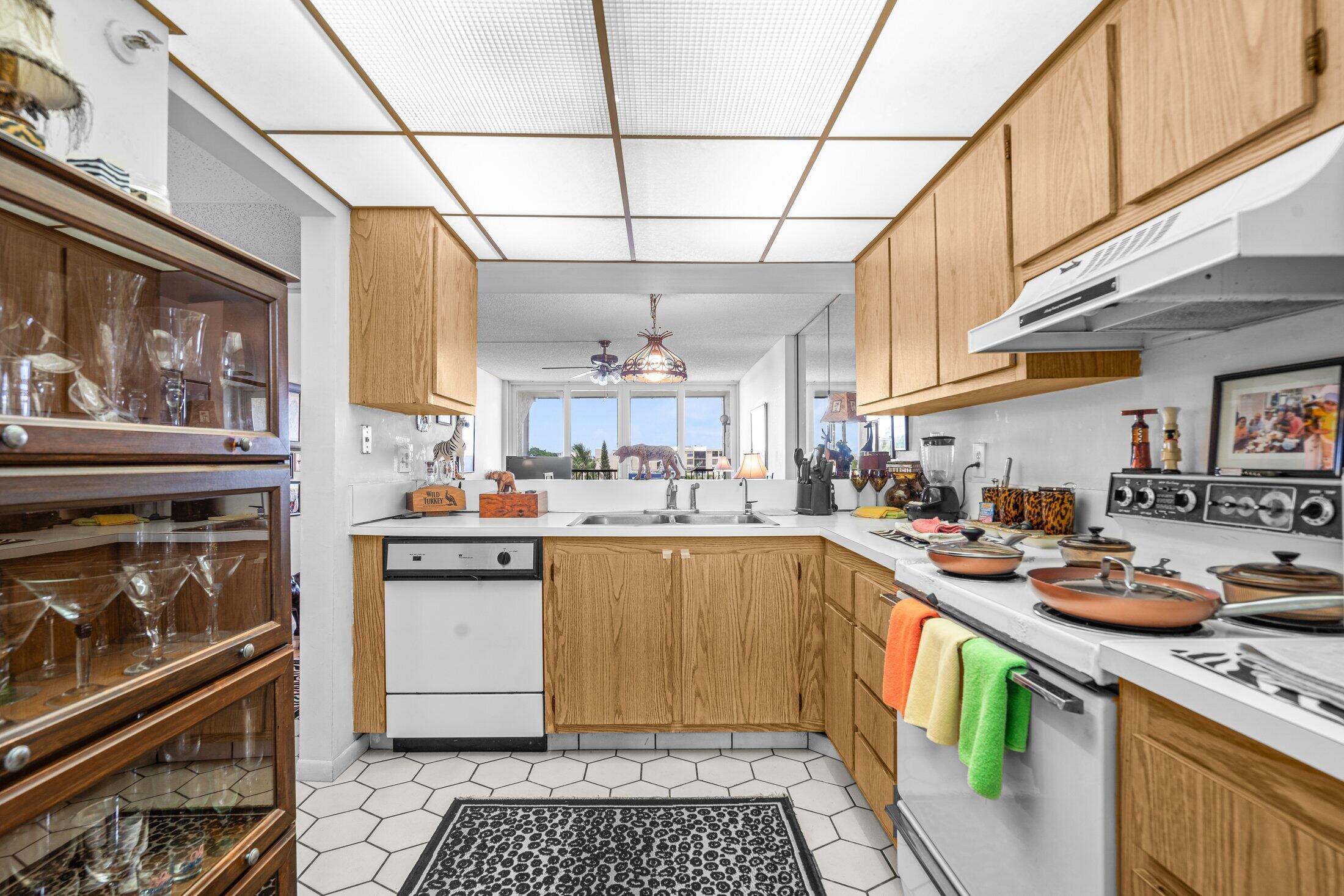 17 Royal Palm Way, Unit 504 Boca Raton, FL 33432 - Photo 7 of 44 a kitchen with stainless steel appliances granite countertop a stove and a refrigerator
