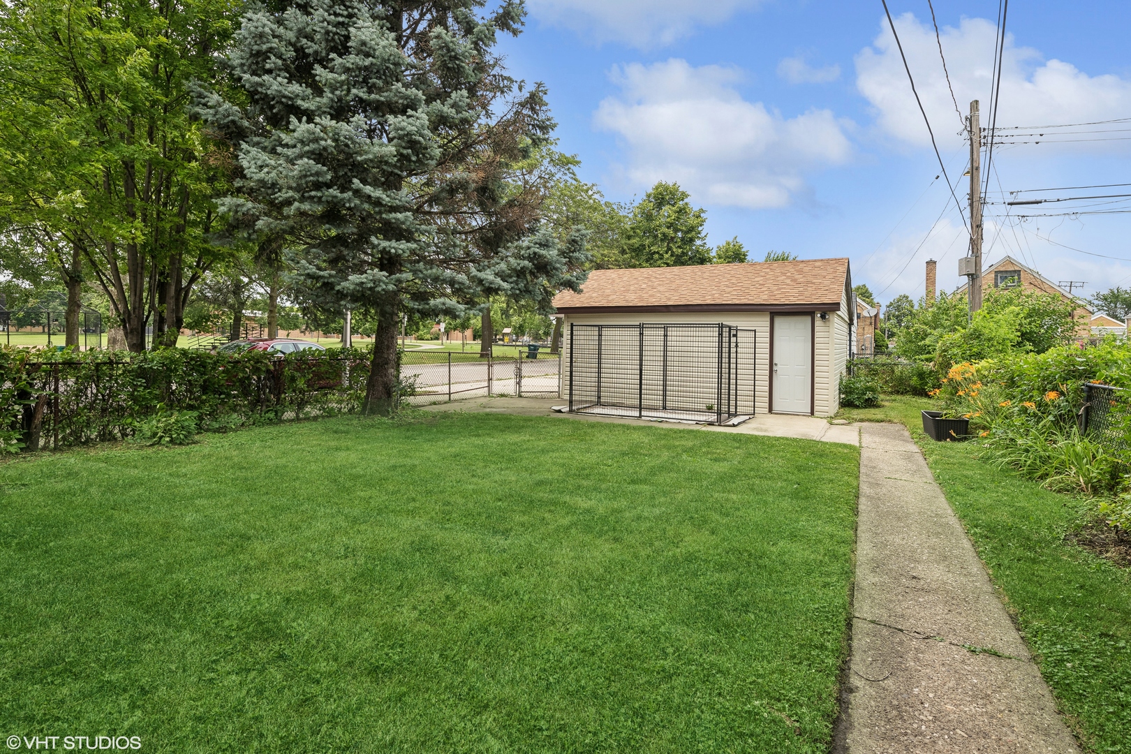 2876 West 84th Street Chicago, IL 60652 - Photo 12 of 16 a view of a house with yard and a garden