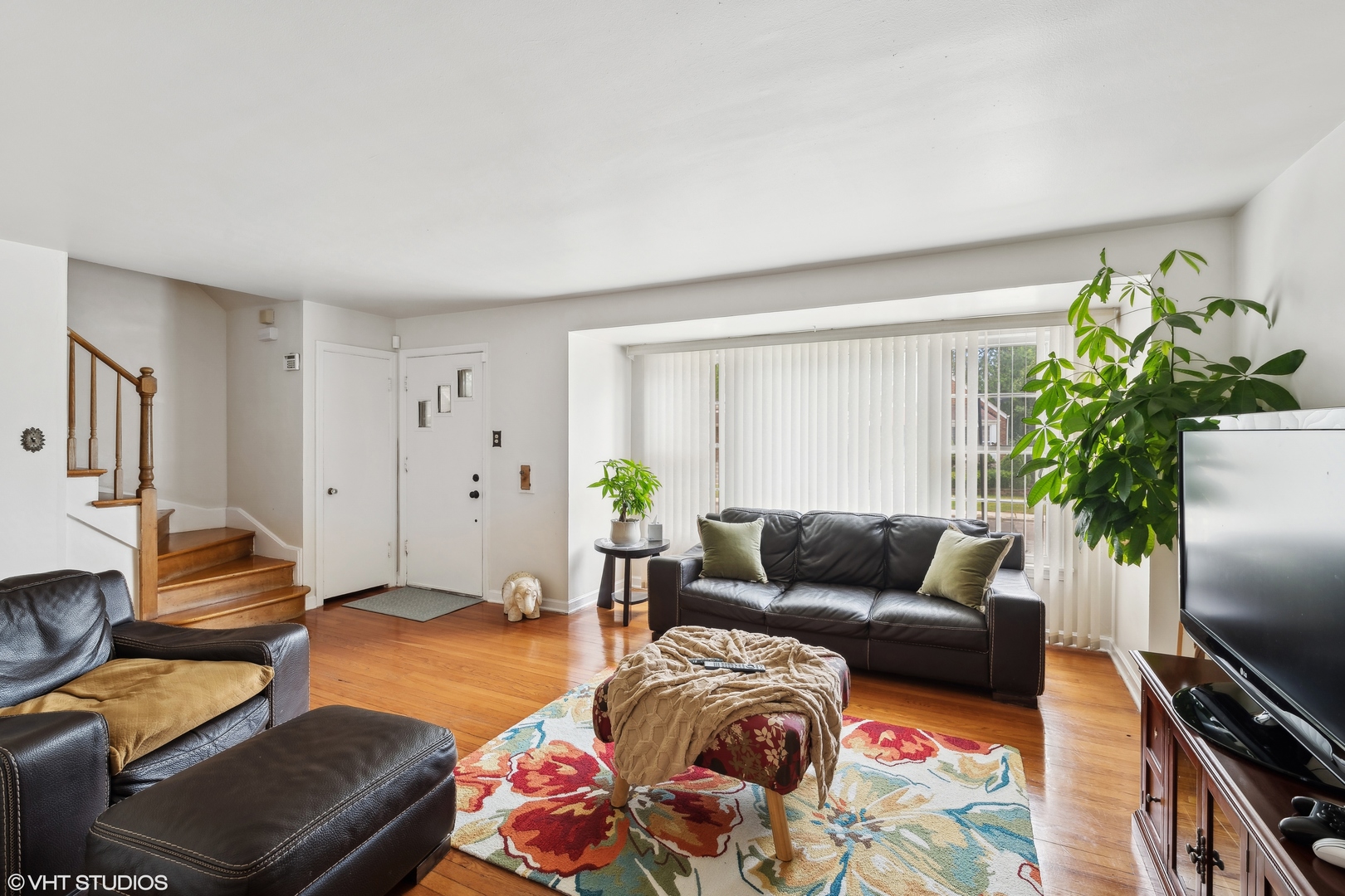 2876 West 84th Street Chicago, IL 60652 - Photo 2 of 16 a living room with furniture and a flat screen tv