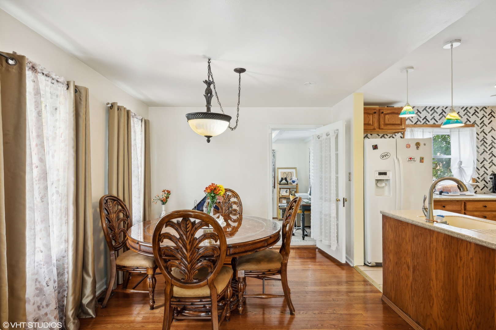 2876 West 84th Street Chicago, IL 60652 - Photo 4 of 16 a dining room with furniture a chandelier and wooden floor