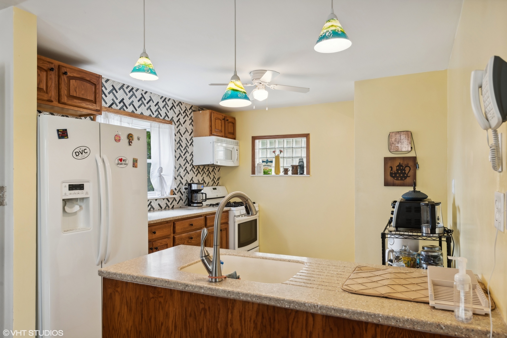 2876 West 84th Street Chicago, IL 60652 - Photo 6 of 16 a kitchen with stainless steel appliances granite countertop a sink a stove and refrigerator