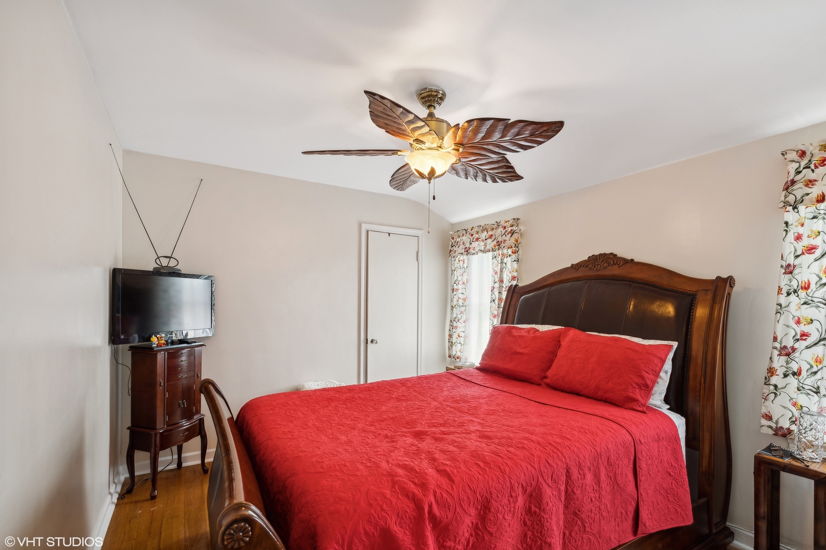 2876 West 84th Street Chicago, IL 60652 - Photo 8 of 16 a bedroom with a bed and a chandelier