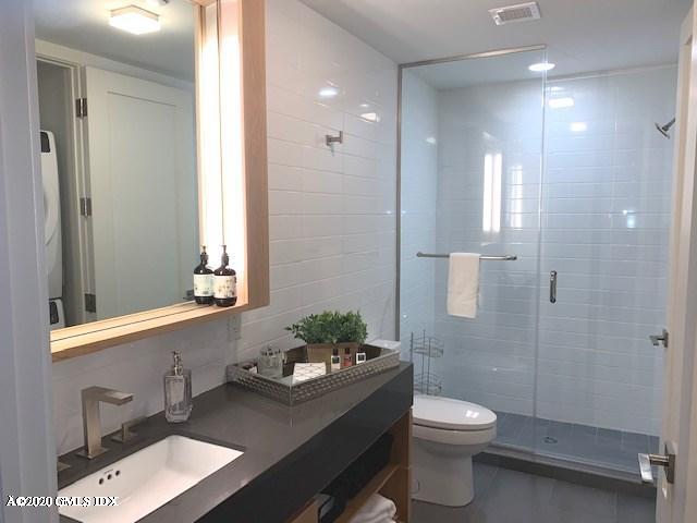 16 Old Track Road, Unit PH 2 Greenwich, CT 06830 - Photo 14 of 23 a bathroom with a sink a toilet and shower