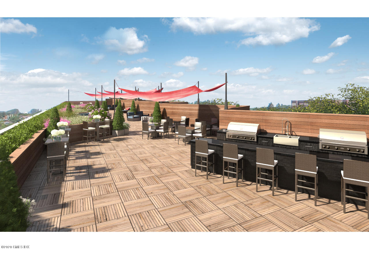 16 Old Track Road, Unit PH 2 Greenwich, CT 06830 - Photo 16 of 23 a view of a patio with a table and chairs