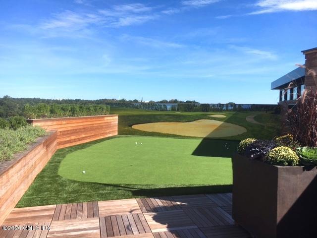 16 Old Track Road, Unit PH 2 Greenwich, CT 06830 - Photo 18 of 23 a view of a lake with a floor to ceiling window next to a city